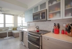 Sleek Greige Kitchen With Pops Of Red